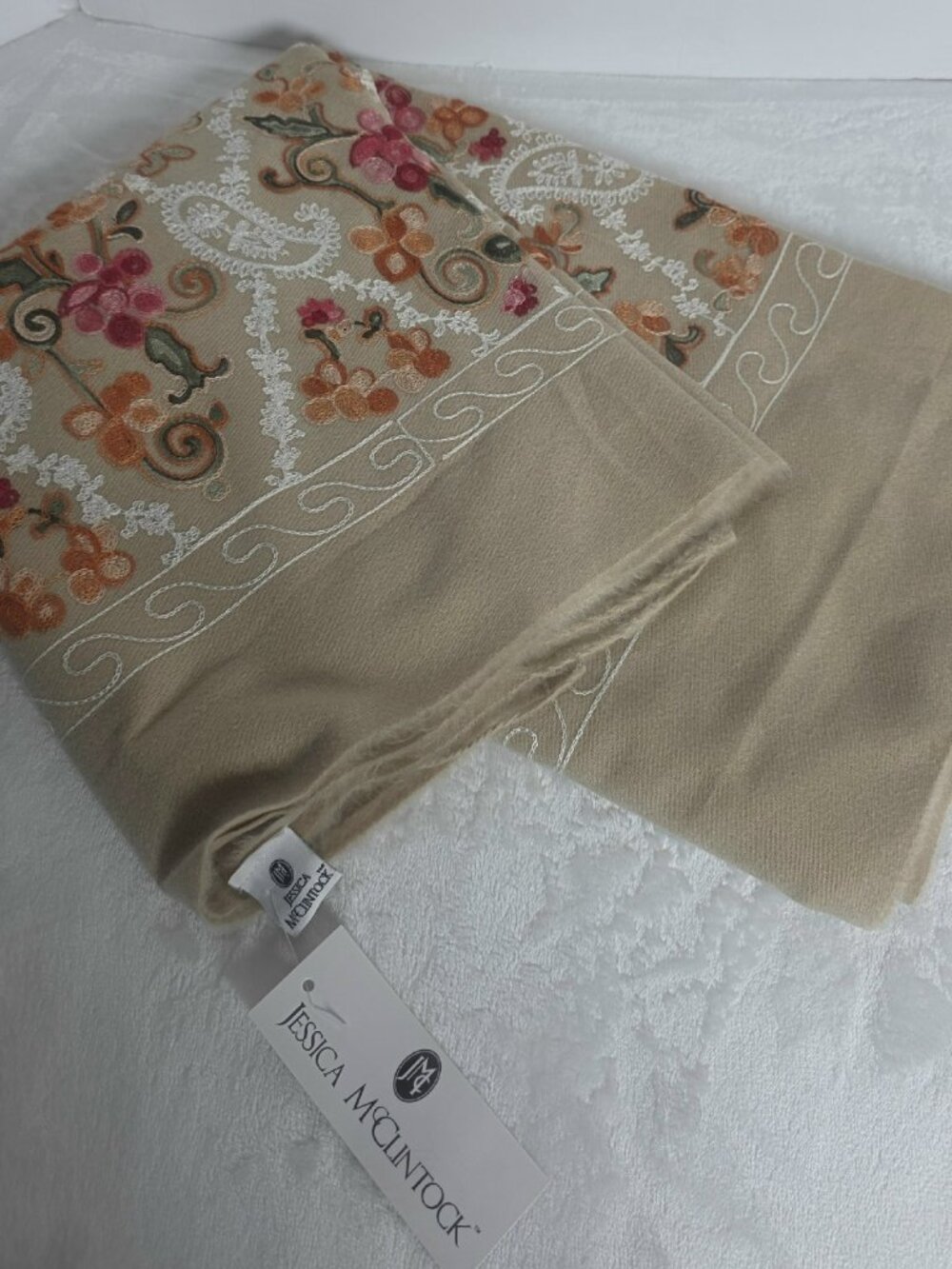 Jessica McClintock beige shawl featuring colorful floral embroidery